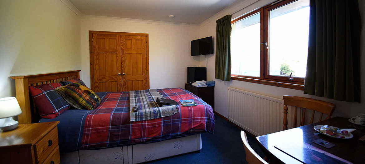 Kenmore Bed and Breakfast accommodation contains a double bed with fridge smart TV and tea coffee making facilities
