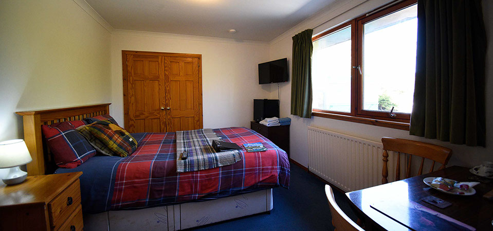 Kenmore Bed and Breakfast accommodation contains a double bed with fridge smart TV and tea coffee making facilities